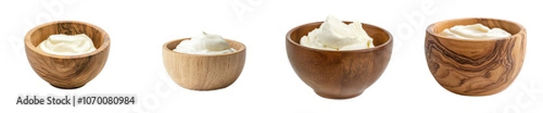 Fototapeta Stack of wooden bowls with sour cream isolated on transparent backgrounds