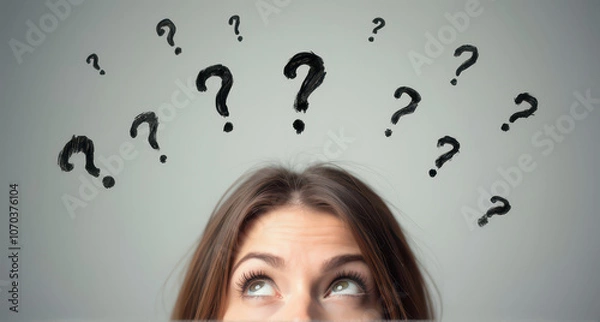Fototapeta A woman's face is depicted in a light grey background, with curious expressions with hand drawn question marks upon her head.