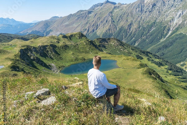 Fototapeta person on the top of a mountain