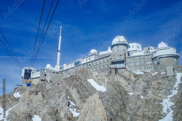 Fototapeta La Mongie, France - 2 Nov, 2024: Cable car from La Mongie to the Pic du Midi, in the French Pyrenees