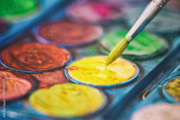 Obraz Brush in watercolors. painter dipping the brush to paint.