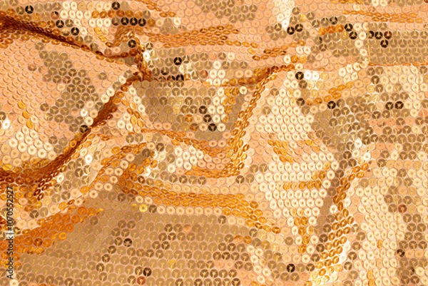 Fototapeta Glamorous golden metallic glowing sequins textile with pink reflection background. Christmas holiday or New Year party concept. Abstract luxury glowing textured background.
