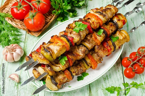 Fototapeta Skewers of pork and vegetables. Barbecuing lunch