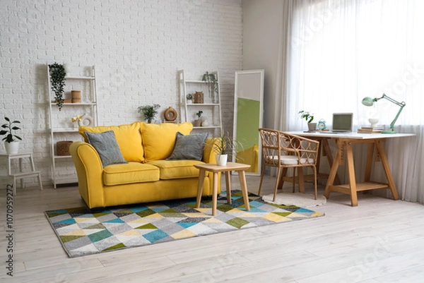 Fototapeta Interior of living room with programmer's desk, sofa and shelf units