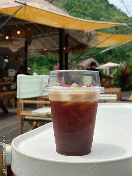 Fototapeta Peach tea, a cold drink with a natural view