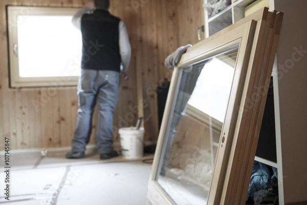 Fototapeta Worker installing new window
