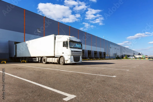 Obraz Cargo truck at warehouse building