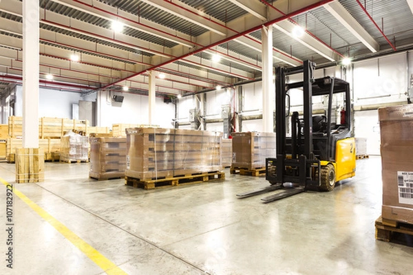 Obraz Large modern warehouse with forklifts