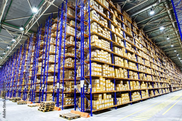 Fototapeta Rows of shelves with boxes
