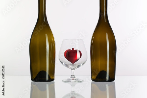 Fototapeta Two bottles and a glass of cognac