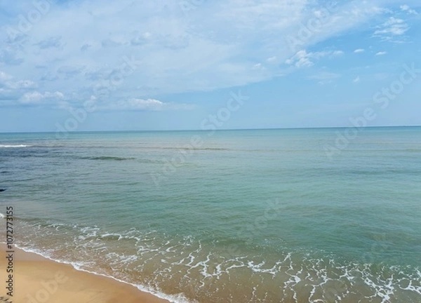 Fototapeta stunning beach view captured on an iPhone in Tamil Nadu, India, showcasing golden sands, gentle waves, and a vibrant horizon under a clear sky, ideal for travel and nature themes.