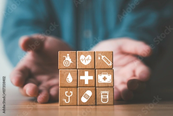 Fototapeta Businessman have giving healthcare icons which print screen on wooden block cube for health wellness and insurance concept.