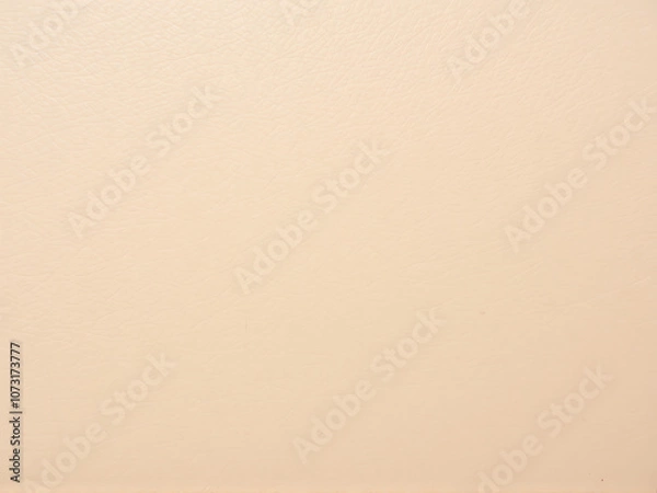 Fototapeta Soft beige surface texture with subtle variations in color and tone, creating a warm and inviting backdrop for design projects
