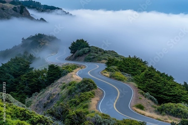 Fototapeta Mysterious Winding Road Disappearing into Thick Fog in a Serene Landscape with Lush Greenery and Enigmatic Atmosphere Captured at Dusk
