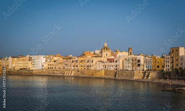Fototapeta View of the historic part of the city of Trapani in Sicily overlooking the sea in the June 2023 with clear sky.