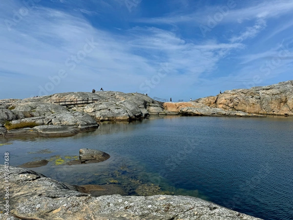 Obraz People walking on a hiking trail in Marstrand island, Sweden