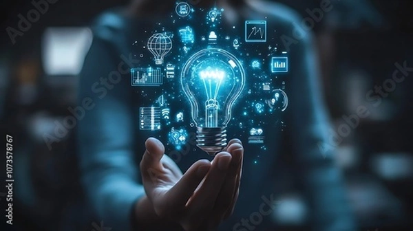 Fototapeta Hand holding an illuminated light bulb with digital icons, Business idea light bulb with technology icon