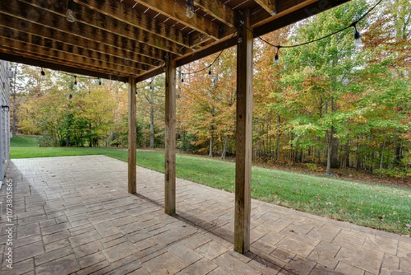 Obraz Tranquil Backyard Patio With Fall Foliage And Lights