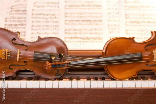 Obraz Two violins on piano keys