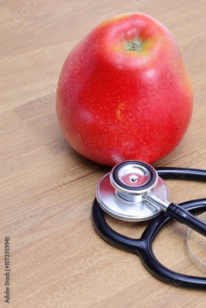 Fototapeta Apple as a symbol of taking care of your health, regular check-ups and taking care of yourself 
and your health.