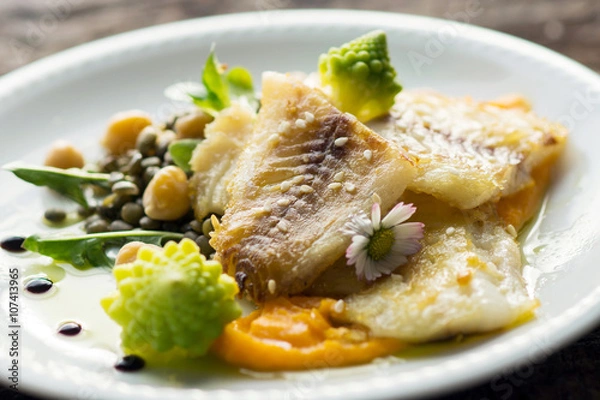 Obraz Fish fillet with chickpeas, carrot puree and vegetables