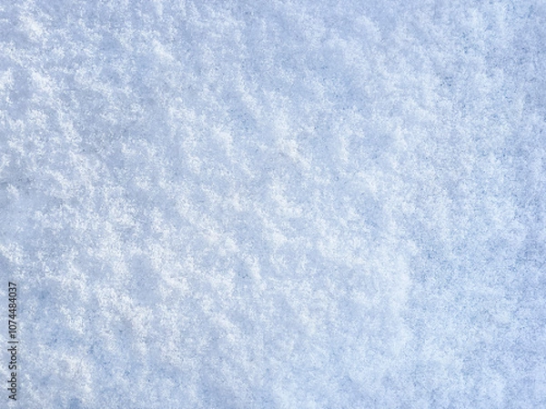 Fototapeta Winter background with snow patterns. Abstract background. The natural texture of snow. The surface of clean fresh snow. Panorama. Close-up view from above. New Year's background. Copy space