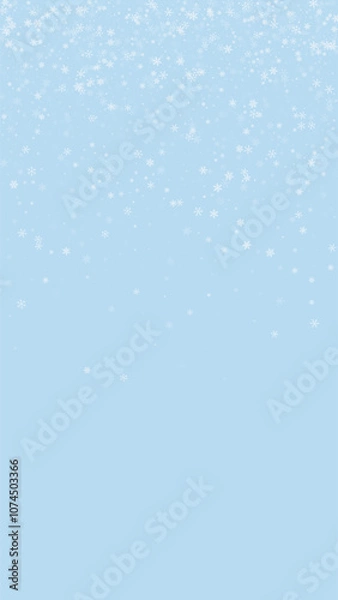 Fototapeta Snowy christmas background. Subtle flying snow flakes and stars on light blue winter backdrop. Delicate sweet snowy christmas. Vertical vector illustration.