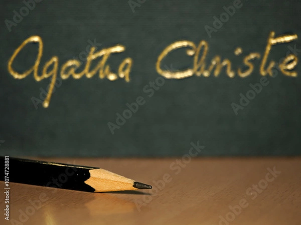 Obraz Black Pencil in front of a green book