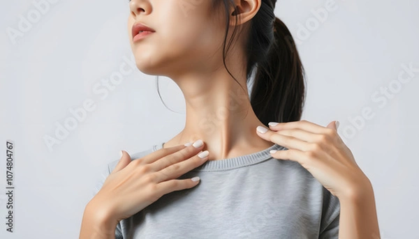 Fototapeta Teenage girl practicing EFT or emotional freedom technique - tapping on the collarbone point isolated with white highlights, png