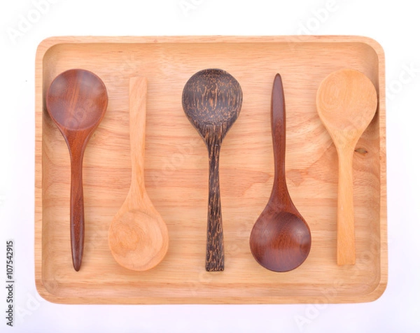 Fototapeta Wooden plate with  spoon isolated on white background