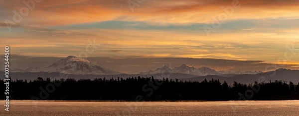 Obraz Mt. Baker during a colorful and dramatic sunrise looking across Hale Passage in the Salish Sea area of western Washington state. Seen from Lummi Islands east side during the minutes before sunrise.