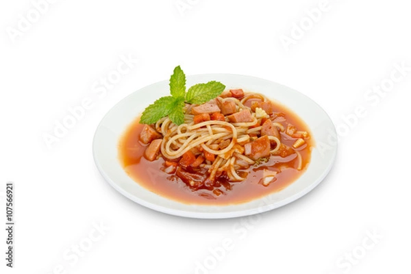 Fototapeta Spaghetti pasta with sausage on black background,clipping path.
