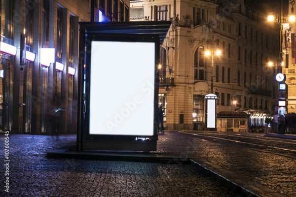 Obraz billboard at bus stop at night