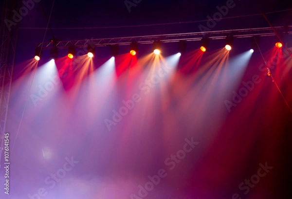Fototapeta Colorful stage spotlights. Lights beam for showing presentation.
