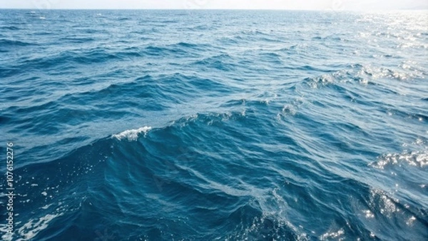 Fototapeta The natural pattern of blue sea surface water, the Texture of natural light, and the waves