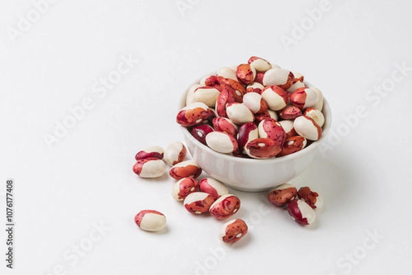 Fototapeta Red and white  kidney beans in white bowl on white background isolated