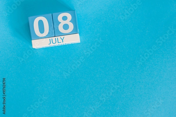 Fototapeta July 8th. Image of july 8 wooden color calendar on blue background. Summer day. Empty space for text