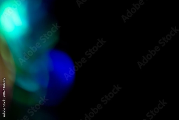 Fototapeta Multicolored highlights on a black background. for overlay to create a festive, vibrant effect