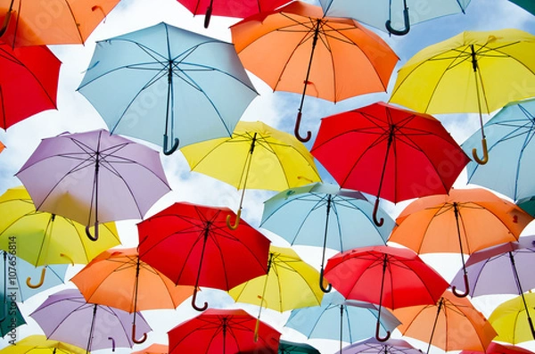 Fototapeta Colorful umbrellas floating