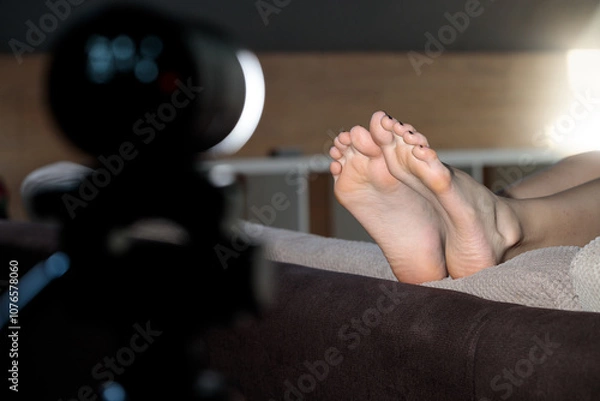 Fototapeta apartment studio photo shoot flash light equipment bare feet soles of unrecognizable female person from the frame