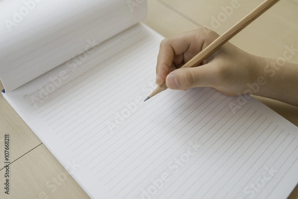 Obraz ノートと鉛筆　女の子の手　