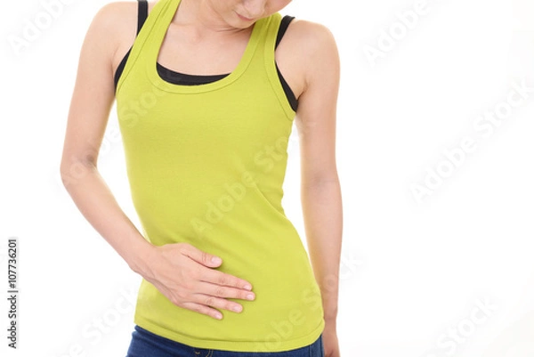 Fototapeta お腹に手を当てる女性