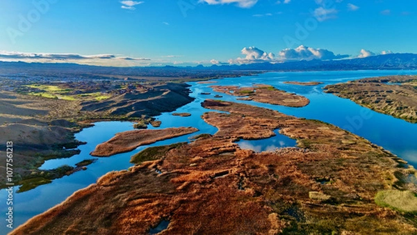 Fototapeta Lake view with grasslands 