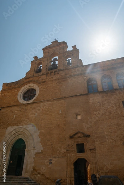 Obraz Cityscape with old historical buildings, narrow street and restaurants in Agrigento, Sicily, Italy