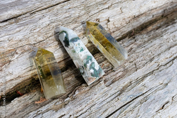 Fototapeta A top view image of two citrine crystal towers with a moss agate tower in the middle. 