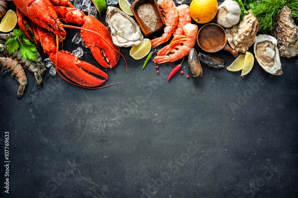 Fototapeta Shellfish plate of crustacean seafood with fresh lobster, mussels, oysters as an ocean gourmet dinner background