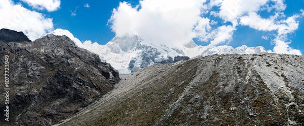 Fototapeta Beautiful snow-capped mountains in the landscape with people climbing to the summit in the Peruvian Andes