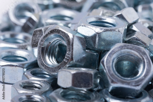 Obraz Pile of metal grey nuts in macro close up image