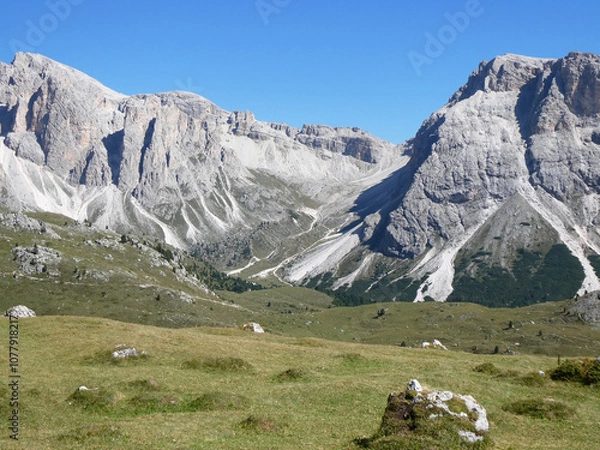 Fototapeta landscape in the mountains, Blue skies on a summers day in Europe Alpine region. Hiking hut-to-hut in the Dolomites.