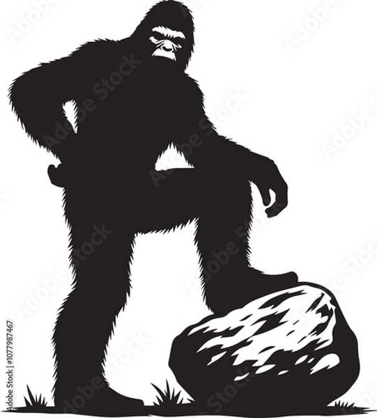 Fototapeta Bigfoot silhouette posing with a large boulder